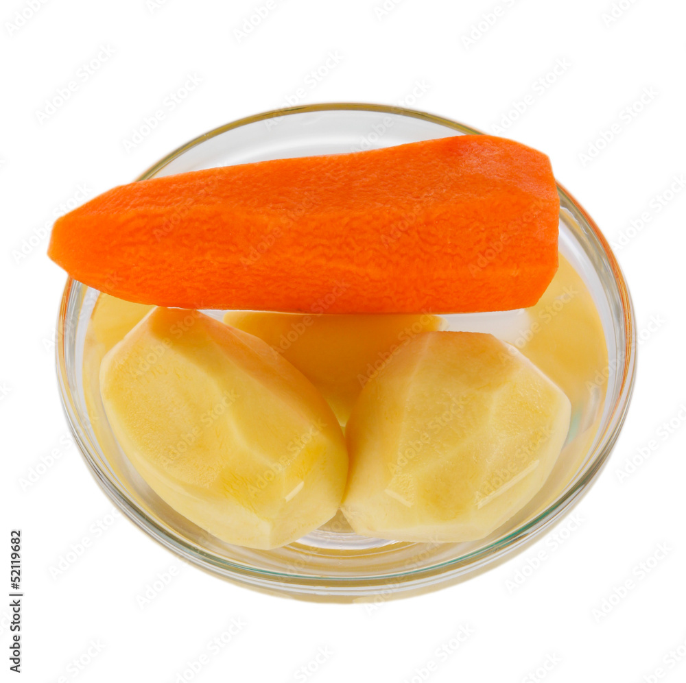 Peeled vegetables in bowl isolated on white