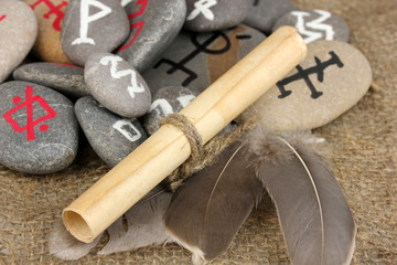 Wall Mural - Fortune telling  with symbols on stones on burlap background