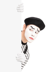 Poster - A mime artist behind a blank panel making a grimace