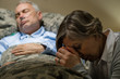 © CandyBox Images - Uneasy senior woman praying for sick man
