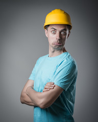 Poster - worker in helmet surprised