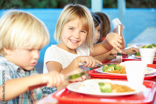 Fotografie, Obraz Elementary Pupils Enjoying Healthy Lunch In Cafeteria