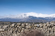 Stone wall. At the background, Guadarrama Mountains, Spain