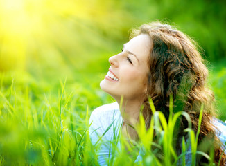 Wall Mural - beautiful young woman outdoors. enjoy nature