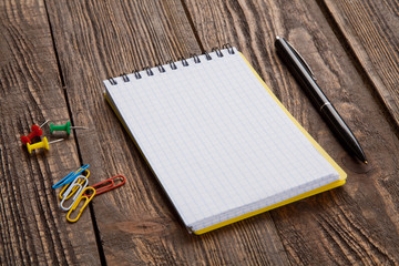 Wall Mural - Notepad on a wooden table