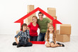 © Ilike - Happy family with kids moving into a new home