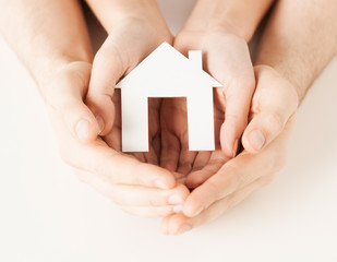 Wall Mural - woman and hands with paper house