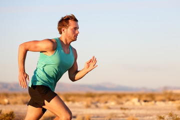 Running man sprinting cross country trail run