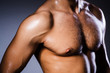 © Elnur - Muscular man in dark studio