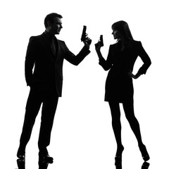 Wall Mural - couple woman man detective secret agent criminal  silhouette