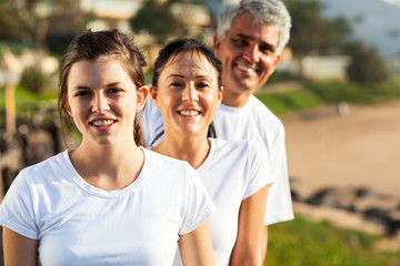 Wall Mural - healthy family portrait at the beach