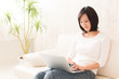 © taka - beautiful asian woman using laptop computer