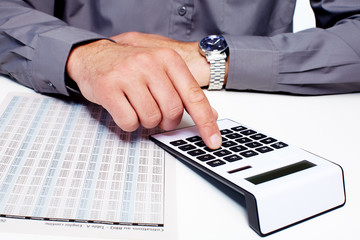 Aufkleber - Hand of a businessman with calculator.