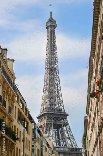 Fototapeta na wymiar Part of Eiffel Tower on the street in Paris, France