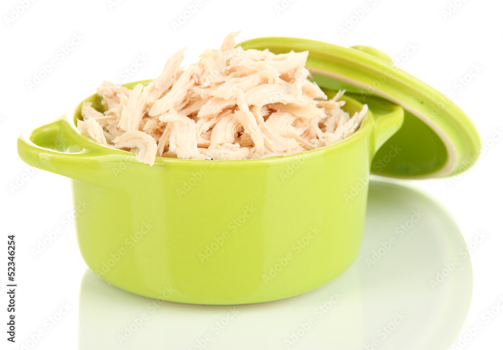 Shredded boiled chicken in green pan isolated on white
