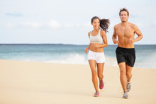 Runners - Young Couple Running On Beach