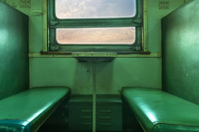 Inside Train And Empty Chair Beside Window
