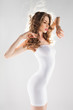 © matusciac - beautiful woman with perfect body in white modeling dress