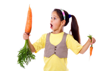 Amazed girl with two carrots