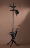 Fototapeta Panele - standing peg with umbrella and hat