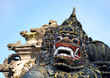 Scary stone barong mask at entrance to Tanah Lot, Bali