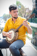 © Eugenio Marongiu - hipster young man playing banjo