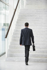 Businessman going upstairs