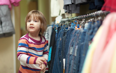 Poster -  two-year child at clothes shop