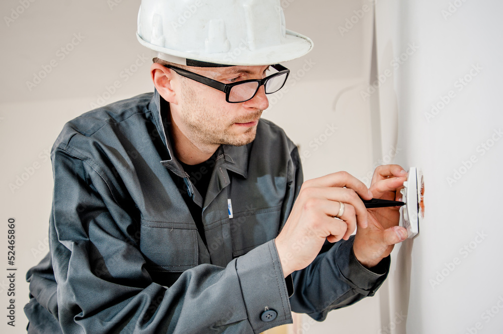 electrician with screwdriver - obrazy, fototapety, plakaty 