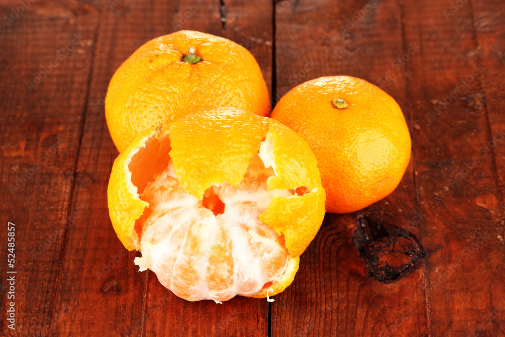 Tasty mandarines  on wooden background