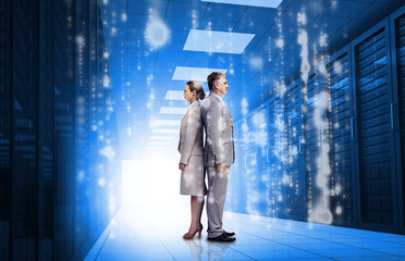 Aufkleber - Business people standing back to back in data center