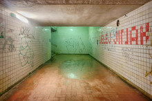 Abandoned And Dirty Subway Tunnel Painted By Graffiti