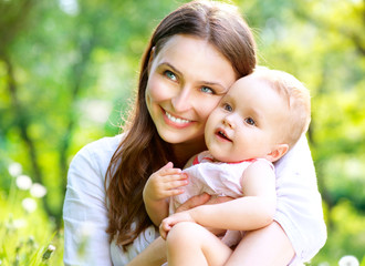 Beautiful Mother And Baby outdoors. Nature