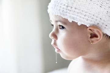 beautiful baby girl drooling with surprise