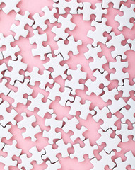 Wall Mural - White puzzle on pink background