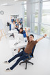 © DragonImages - Excited businesspeople