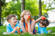 © sakkmesterke - Healthy family with apple