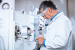 © lightpoet - Senior male researcher carrying out scientific research in a lab