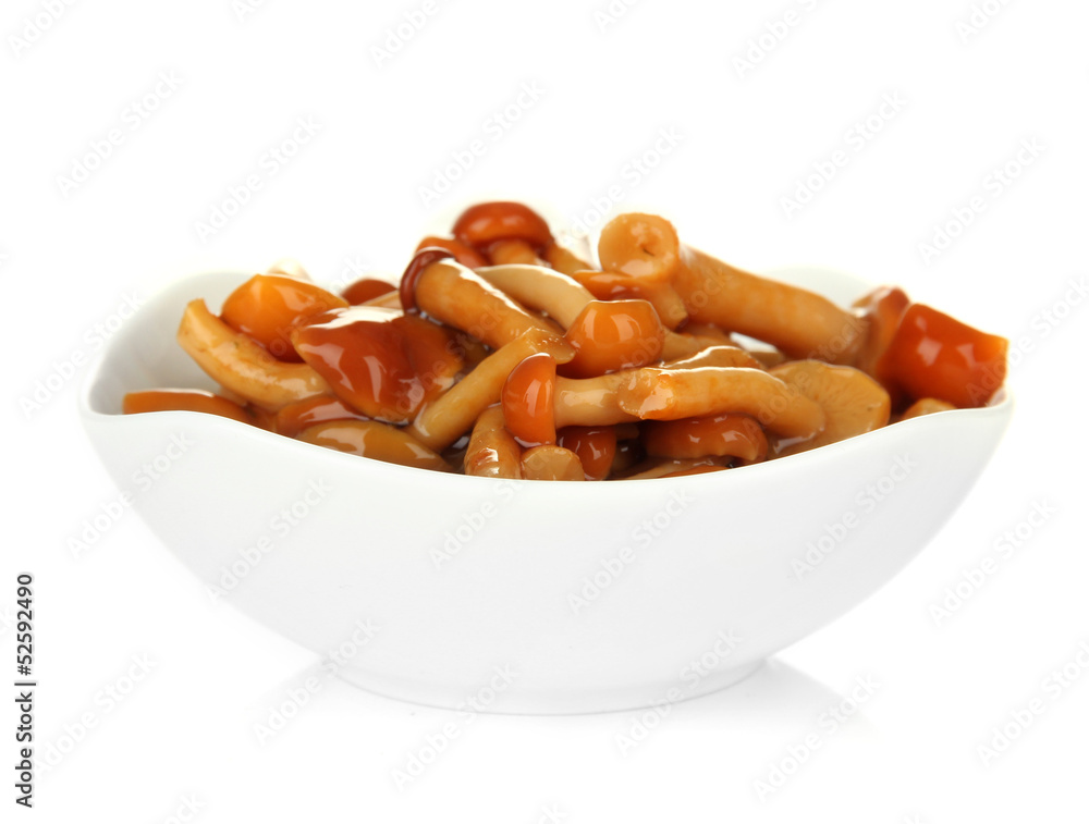 Mushrooms in bowl, isolated on white
