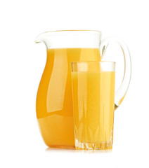 Jug, glass of orange juice and orange fruits