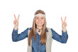 Pretty girl with hippie clothes making the peace symbol