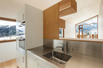 home interior with concrete walls, view from the kitchen