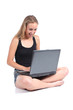 © Antonioguillem - Beautiful woman sitting with crossed legs with a laptop