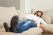 © Minerva Studio - Man relaxing on his couch