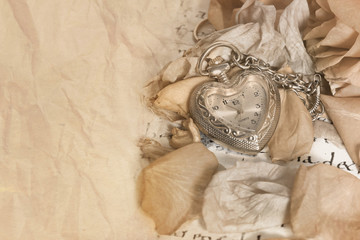 old pocket watch in a vintage romantic letter