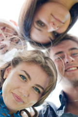 Sticker - Four happy teenage friends looking together in camera outdoors