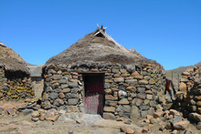 Traditional Style Of Housing In Lesotho At Sani Pass