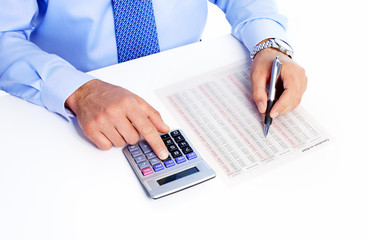 Fototapete - Hand with calculator.