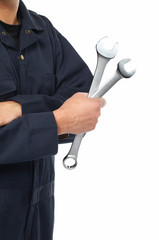 Hand of auto mechanic with wrench.