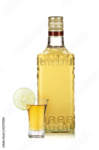 Fotografie, Obraz Bottle of gold tequila and shot with lime slice